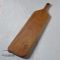 Long paddle cutting board woodgrains detail view